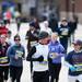 Participants smile at each other during the first lap of a run in honor of the Boston Marathon on Saturday, April 20. AnnArbor.com I Daniel Brenner